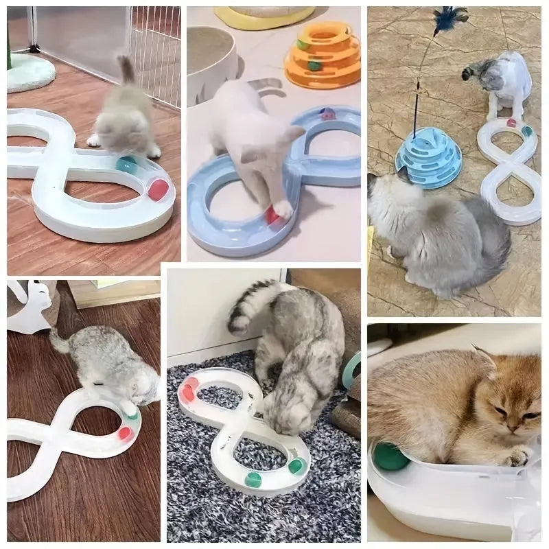 Blue and white plastic cat turntable track ball toy with a teasing stick on a flat surface.