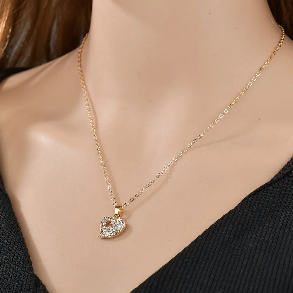 Gold electroplated alloy jewellery set with earrings, pendant necklace and bracelet for women