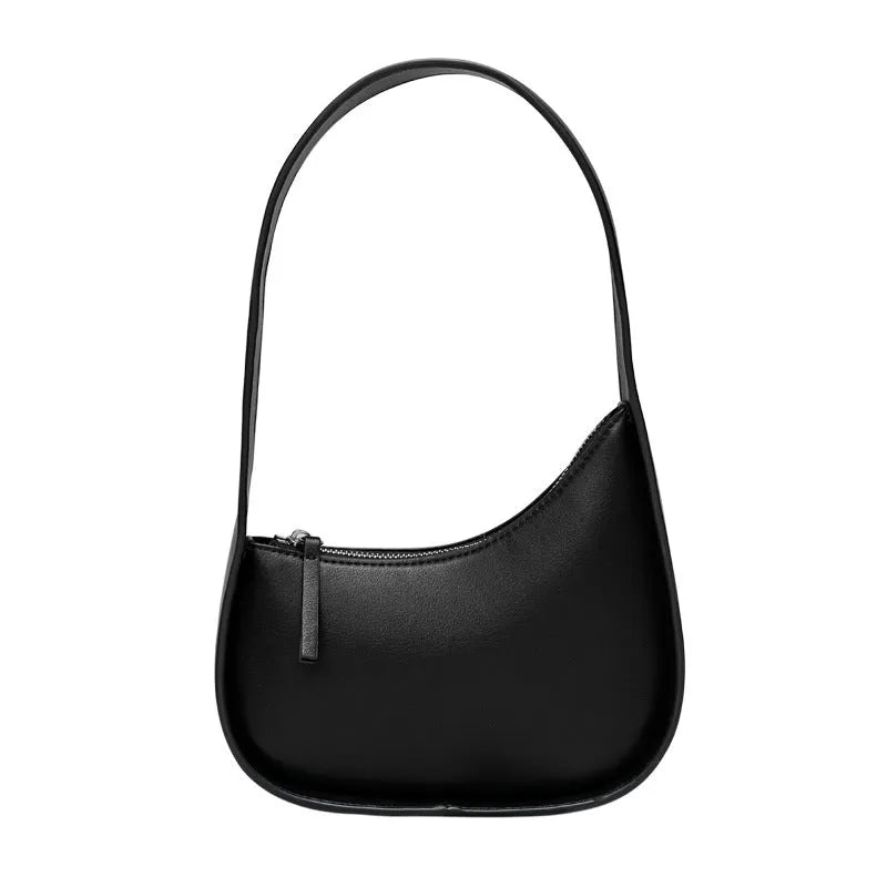 Small genuine cowhide leather half moon handbag with a wide shoulder strap.