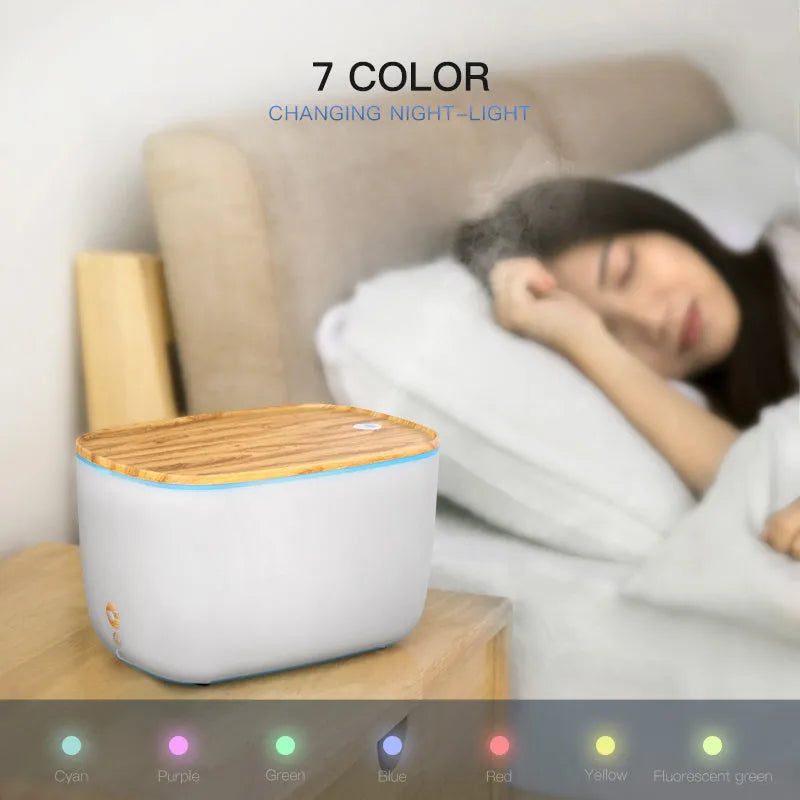 GX-22K white aroma diffuser humidifier with night light on a wooden table.