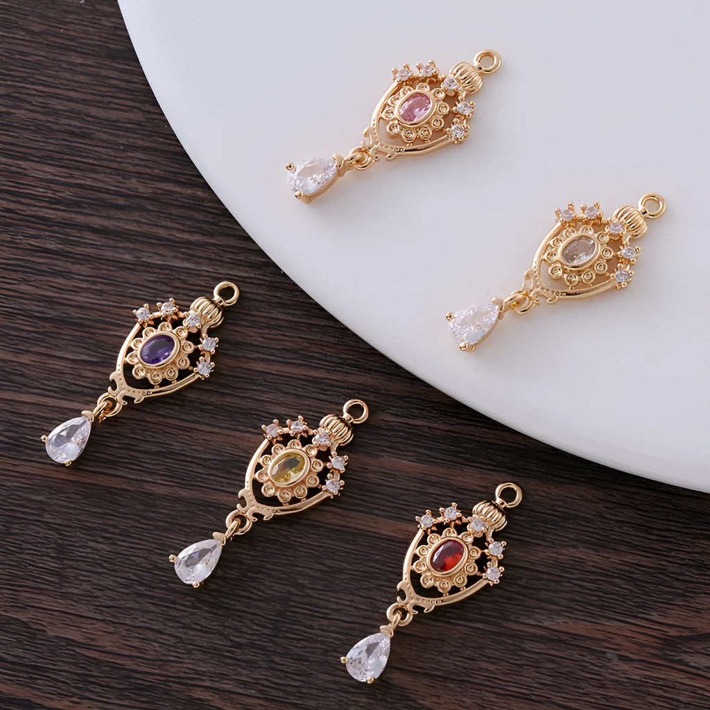 Water drop shaped pendant with hollow crown design and zircon detailing in five colour options