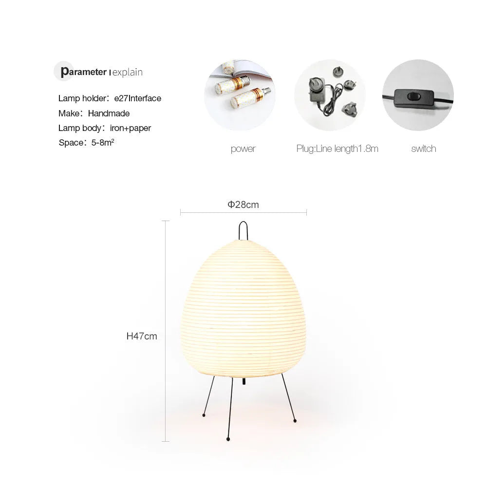 Japanese style table lamp with rice paper shade and aluminium base showing warm glow