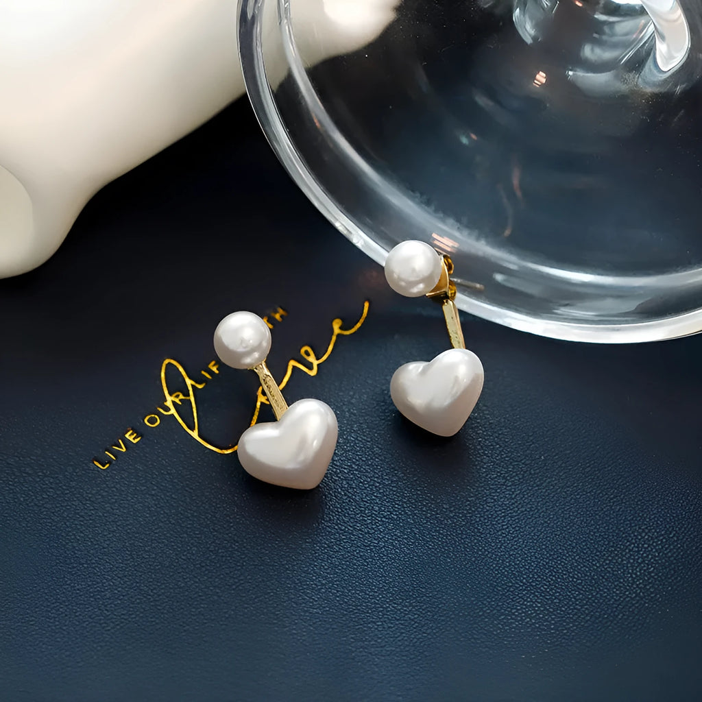 Korean style heart-shaped women's stud earrings with pearl design and alloy construction