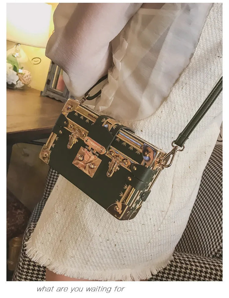 Women's hard-shell PU shoulder bag with flap closure in black or green