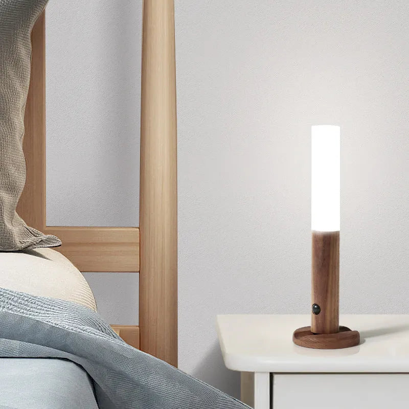 Smart sensor LED desk lamp with solid wood base on a desk