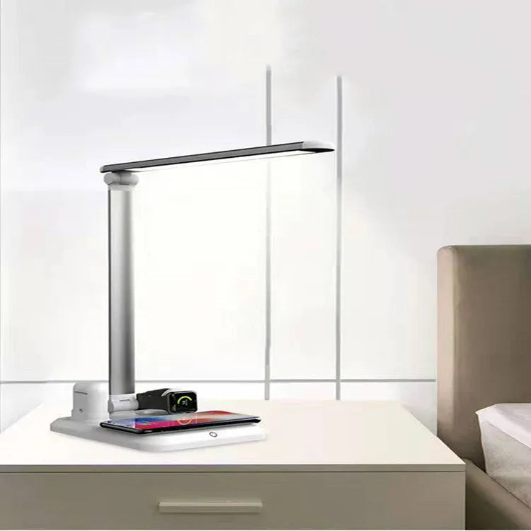 Black or white X-1 4-in-1 LED desk lamp showing wireless charging surface and USB port