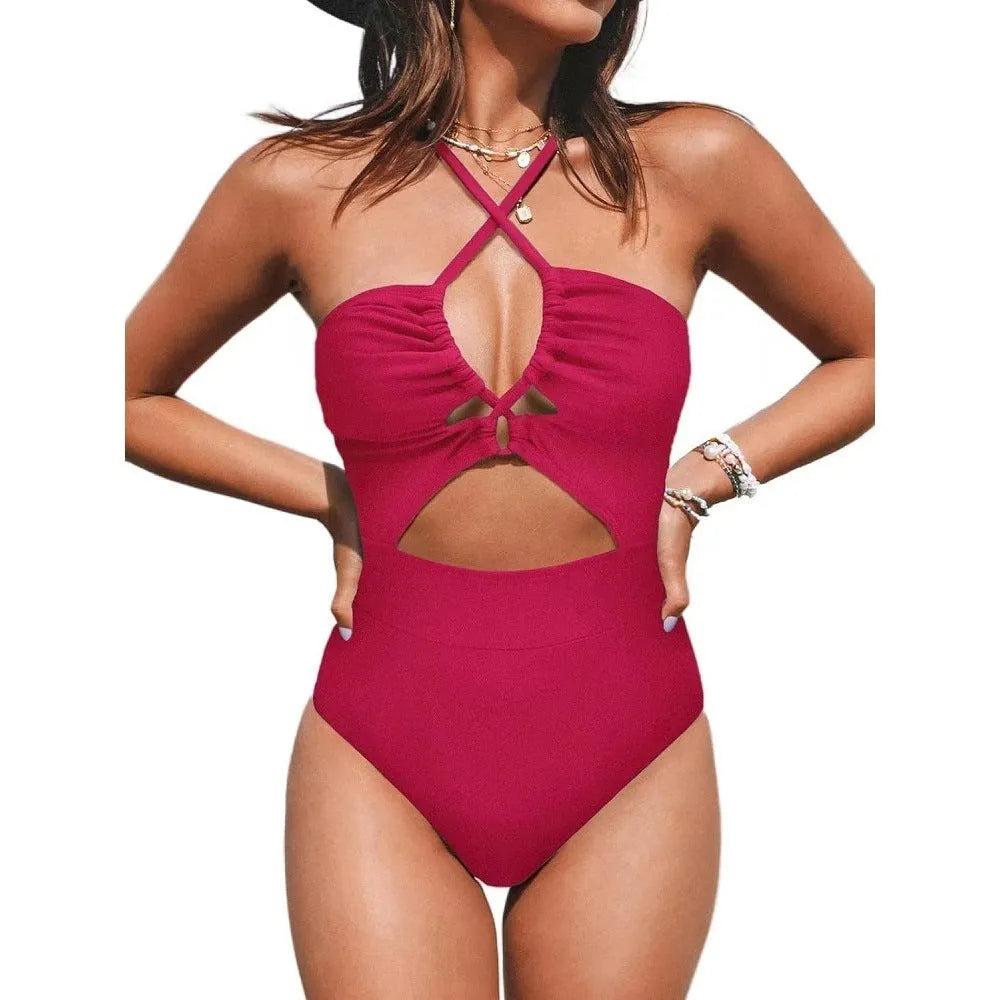 Solid colour women's one-piece swimsuit with a cross-back backless design, shown in black.