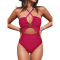 Solid colour women's one-piece swimsuit with a cross-back backless design, shown in black.