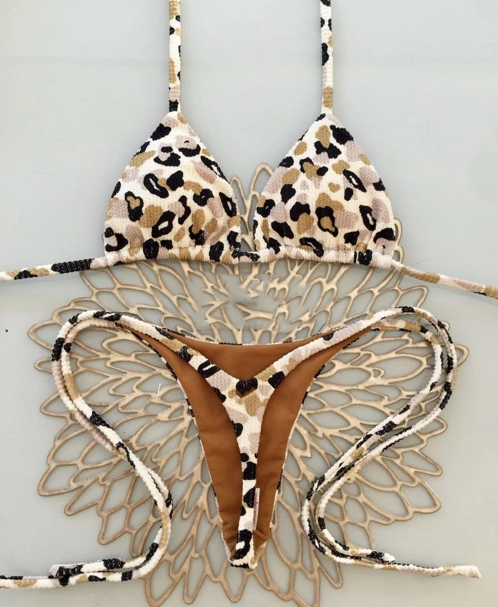 Women's printed beach bikini swimsuit with cotton lining on mannequin