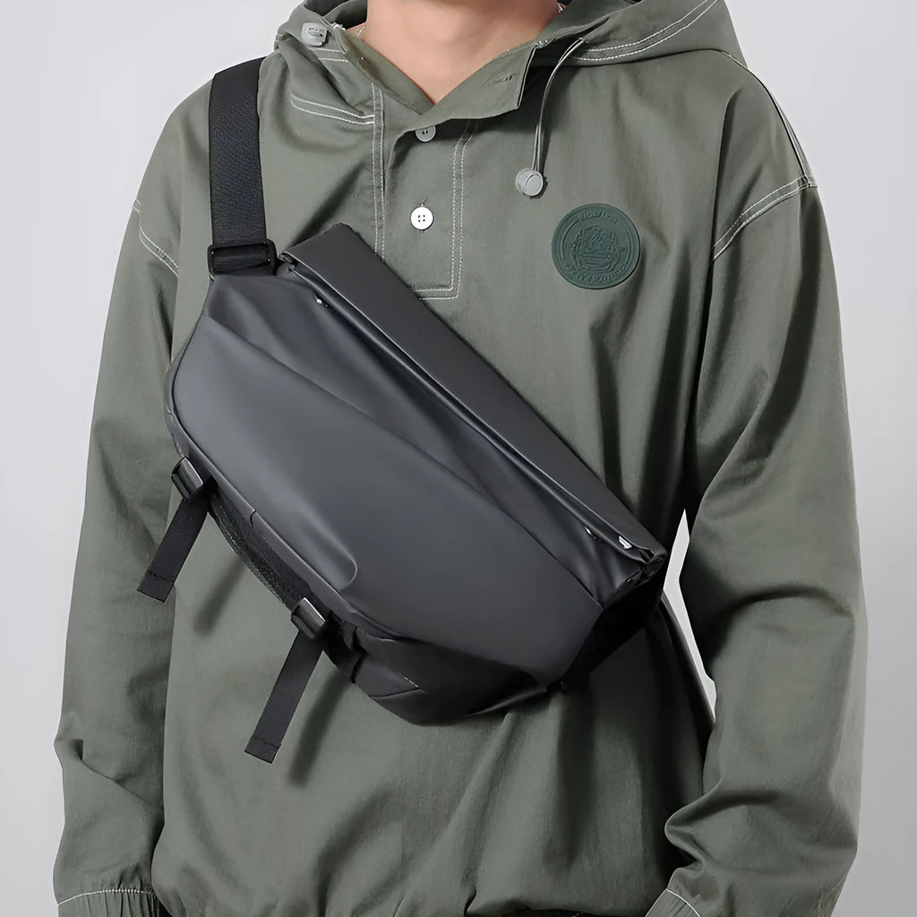 Grey medium crossbody bag with zipper opening showing internal phone and document compartments