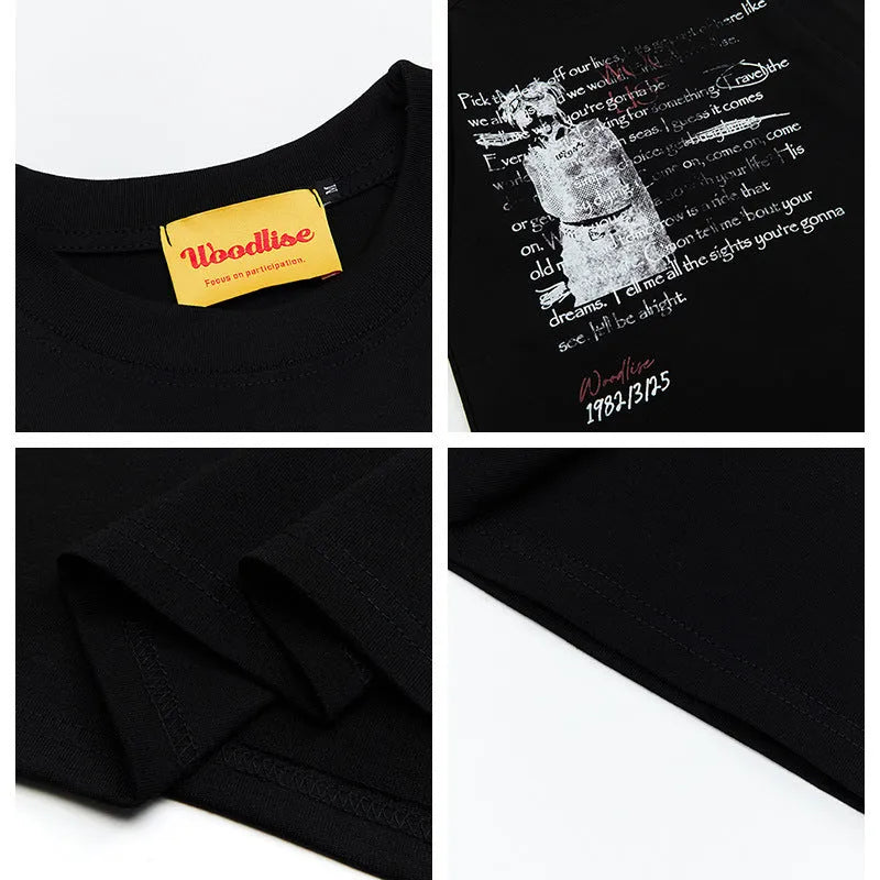 Men's black loose retro t-shirt with white letter print and short raglan sleeves.