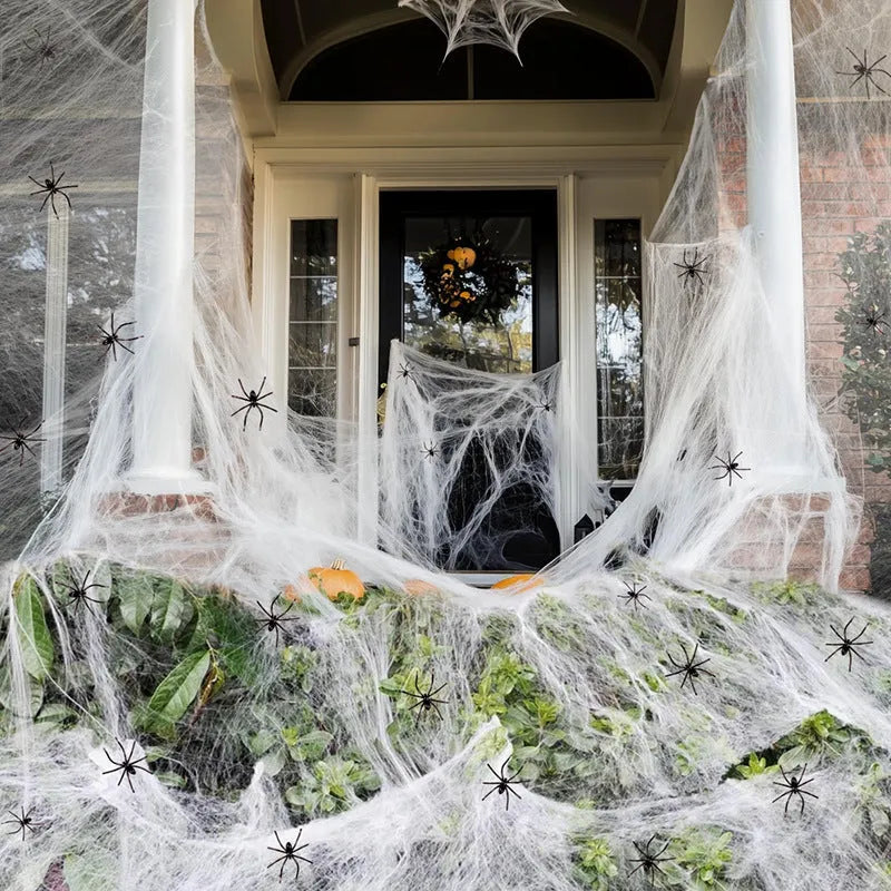 White cotton spider web Halloween decoration with plastic spiders in various pack sizes