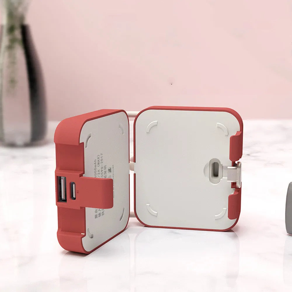 Handbag clip-on power bank in blue showing phone stand function and Type-C/Lightning ports.