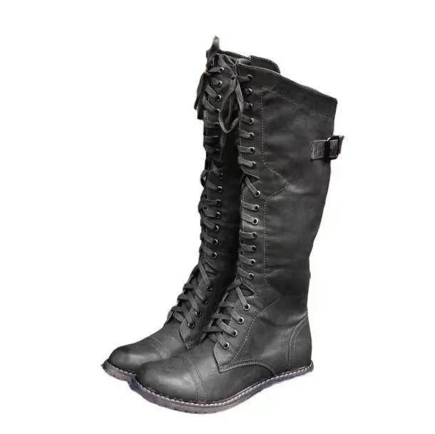 Women's black chunky heel high leg ankle boots with a round toe and low rubber sole.
