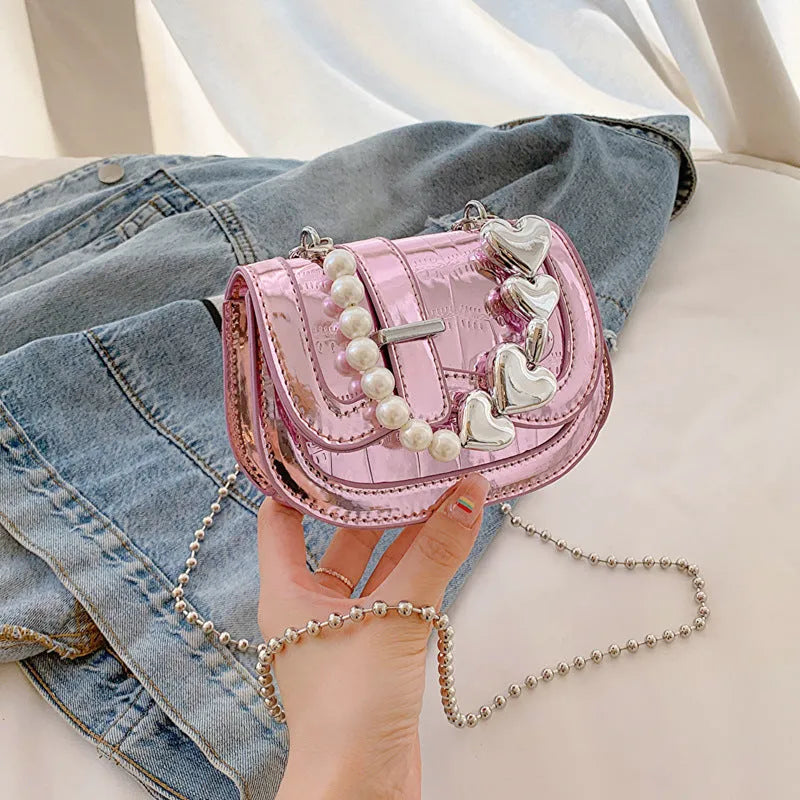 Women's mini saddle crossbody bag in horizontal square design with single shoulder strap