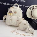 Women's three-piece floral PU leather bag set showing backpack, shoulder bag, and card purse in black.
