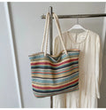 Blue straw woven single-shoulder bag with nylon construction and polyester lining.