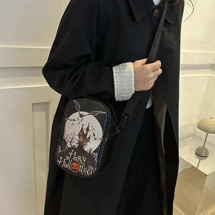 Halloween graffiti print crossbody bag with pumpkin ghost bat designs in black colour
