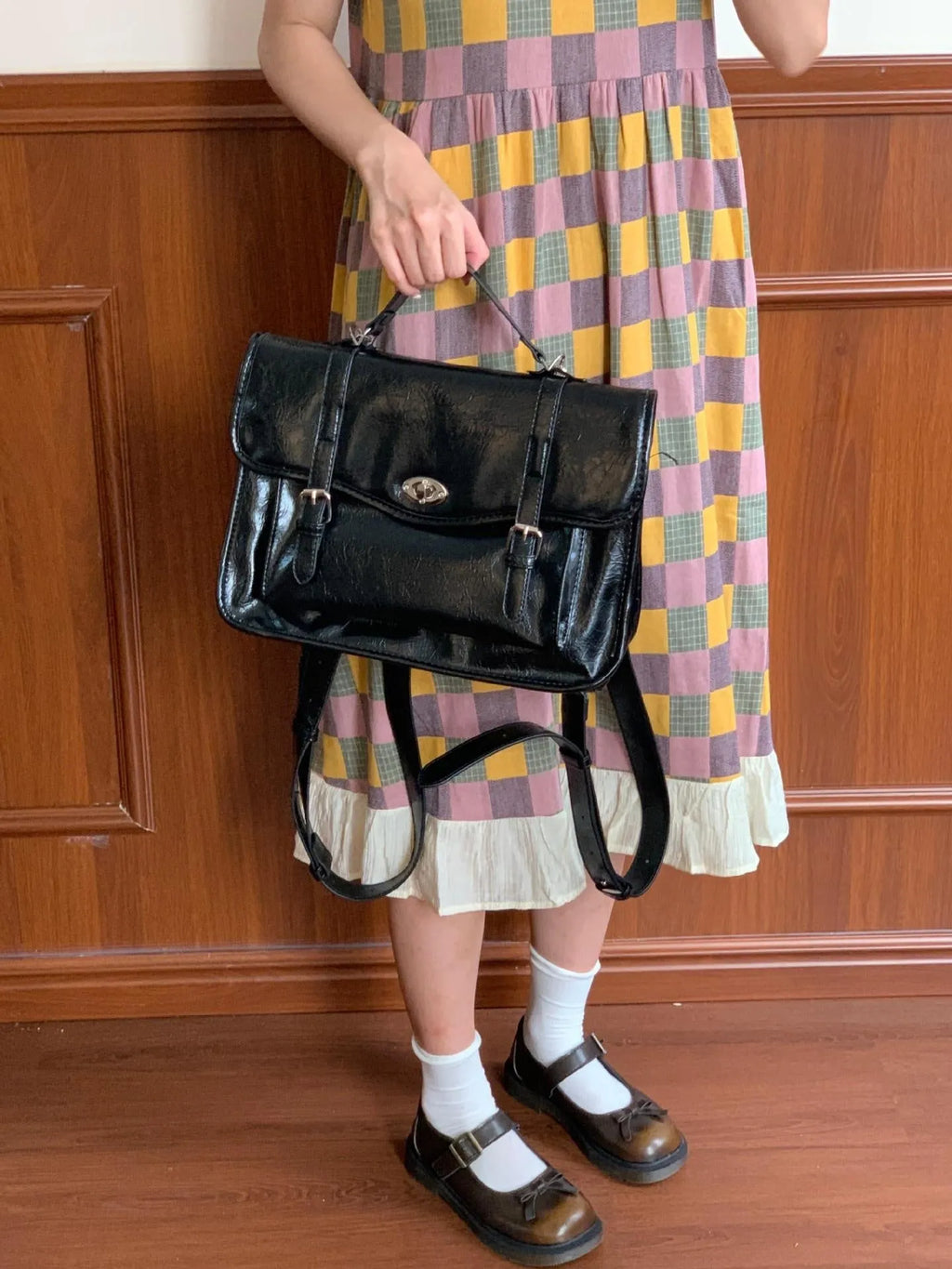Black oil wax leather-style messenger bag for women with 35cm length and shoulder strap