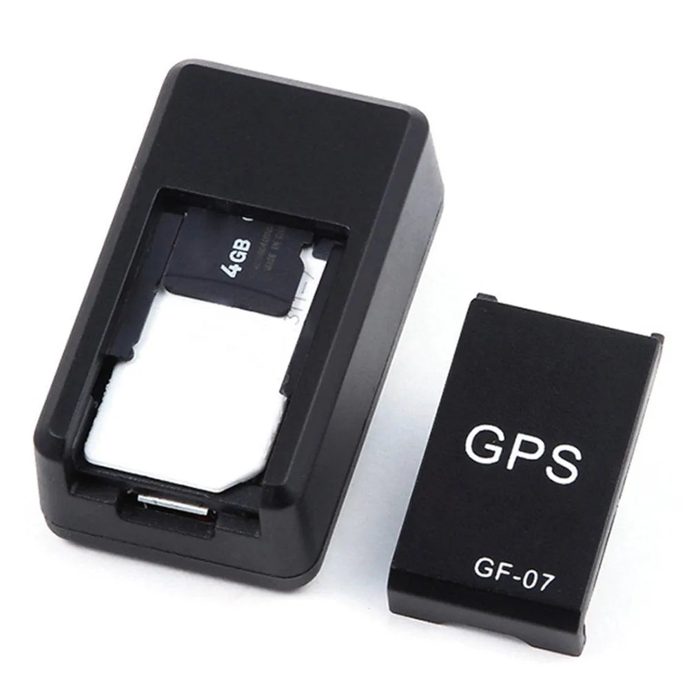 Black plastic mini magnetic GPS car tracker measuring 35×20×14mm with USB charging cable