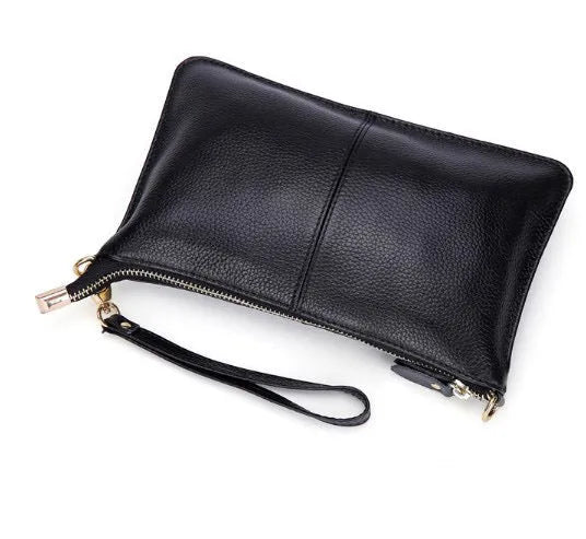 Cowhide lady's slant bag showing front compartment, adjustable long shoulder strap, and hand strap in a choice of colours