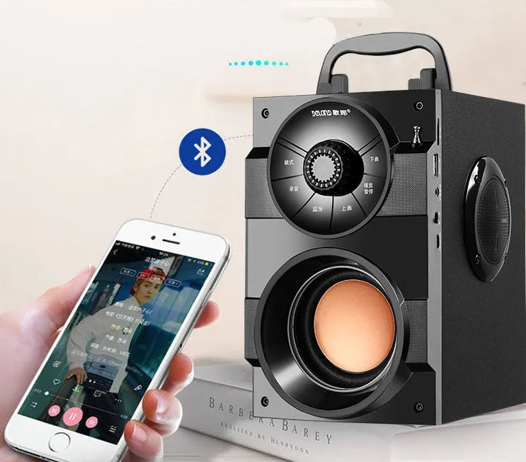 Black portable mini home audio system with subwoofer showing front speakers and connection ports
