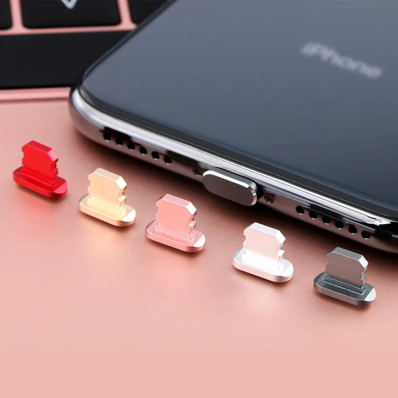 Aluminium alloy dust plug for iPhone charging port in various colours including gold, silver, and rose gold.