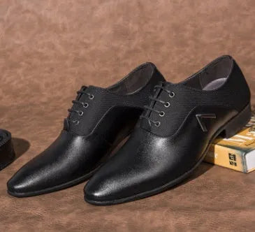 Men's black Oxford shoe with artificial PU upper and rubber sole on a white background