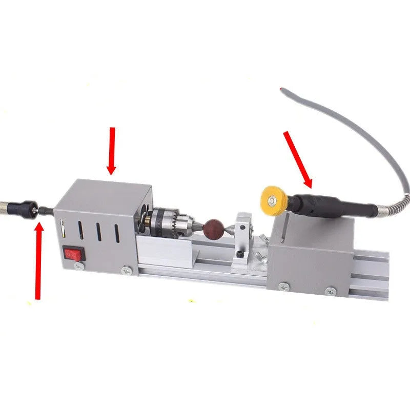 Mini metal woodworking lathe with carving knives on workbench