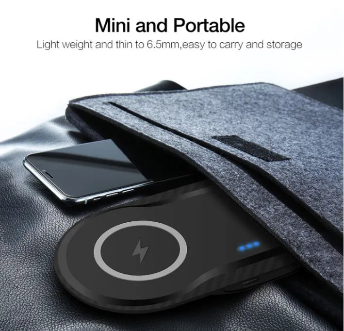 Black and white dual Qi wireless charging pad charging two smartphones simultaneously