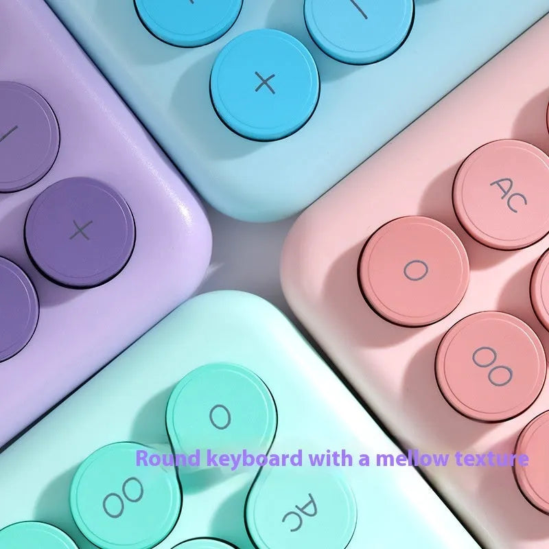 Solar-powered desktop calculator with a violet and white gradient colour design on a desk.