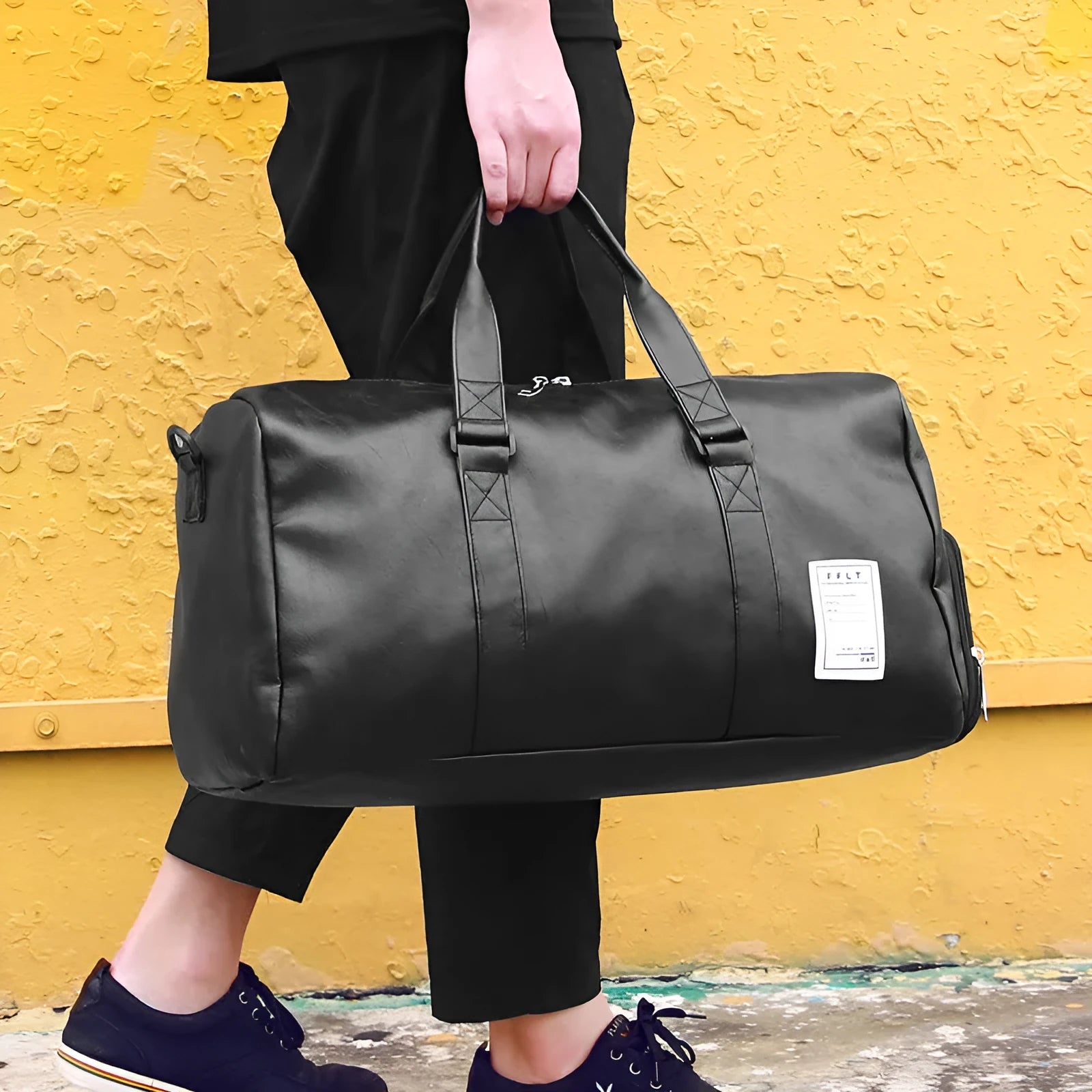 Large black waterproof sports gym bag with separate side shoe compartments and a diagonal carry strap.