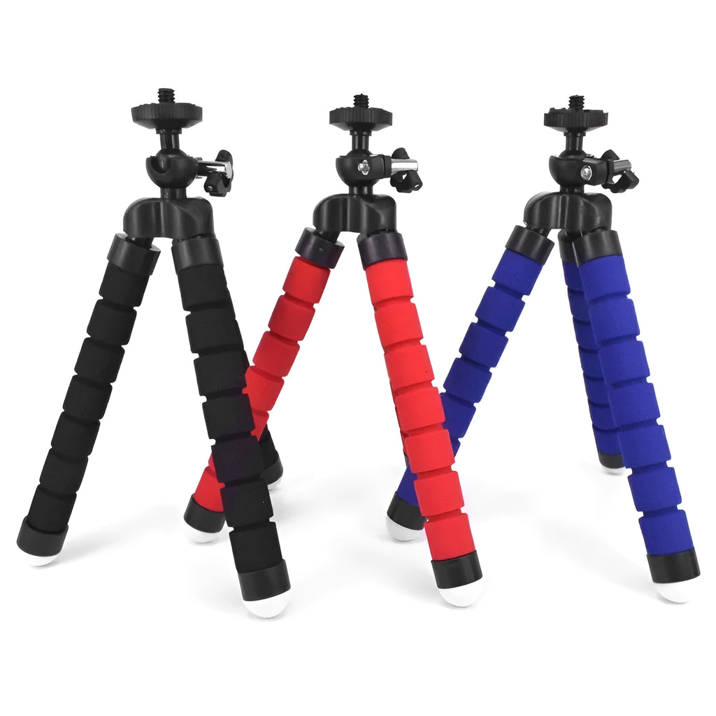 Black flexible octopus tripod with bent legs holding a smartphone mount on a wooden table.