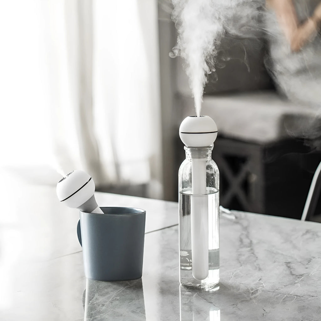 Pink and white columnar USB desktop humidifier with 1 litre water tank