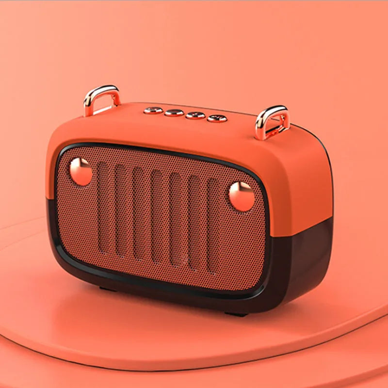 Portable mini Bluetooth speaker with plastic shell in choice of five colours including black, blue, green, grey, and orange