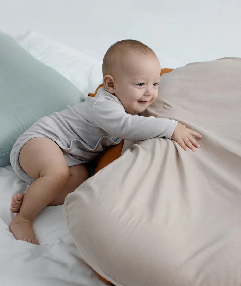 Beige portable cotton baby nest bed crib for newborns, measuring 75 cm by 45 cm.