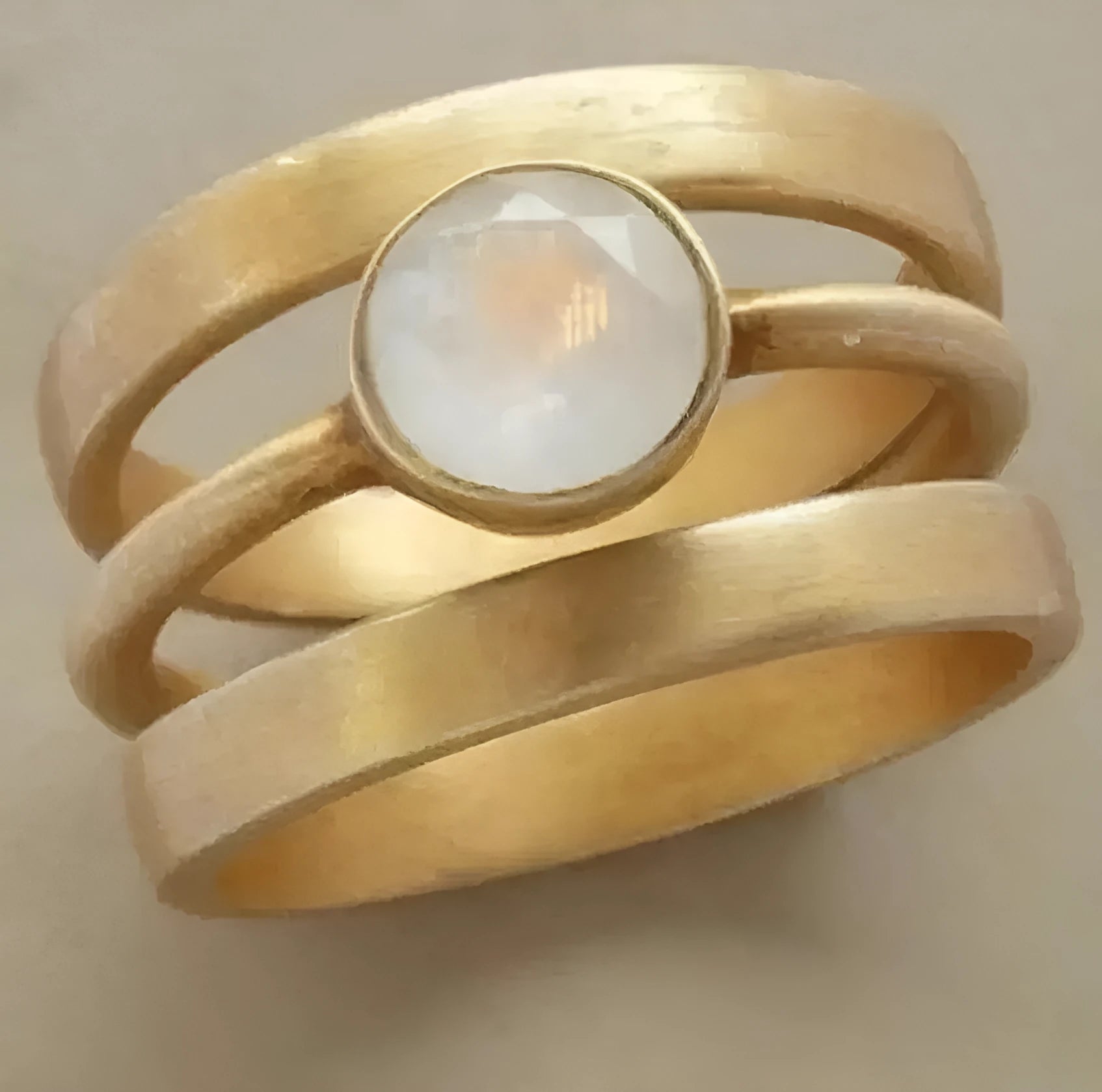 Gold-plated geometric ring with hollow construction and micro-inlaid white chalcedony detailing