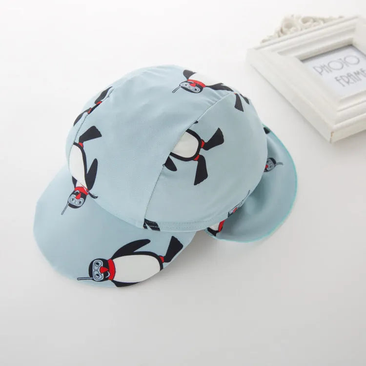 Boys penguin print long sleeve swimsuit with matching swimming cap