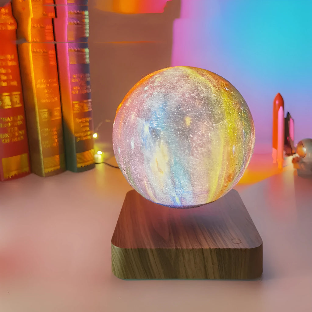 Levitating galaxy moon lamp floating above walnut colour base with starry light pattern