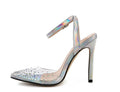 Women's pointed-toe stiletto sandals with a clear PVC upper.