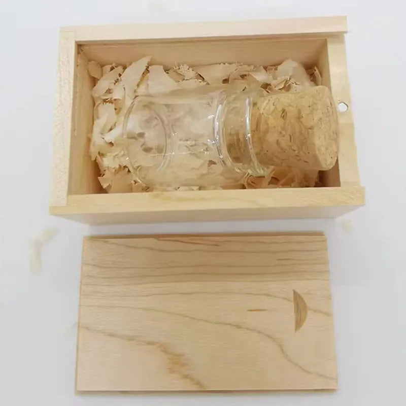 Transparent wooden wish drift bottle shaped USB flash drive on white background.