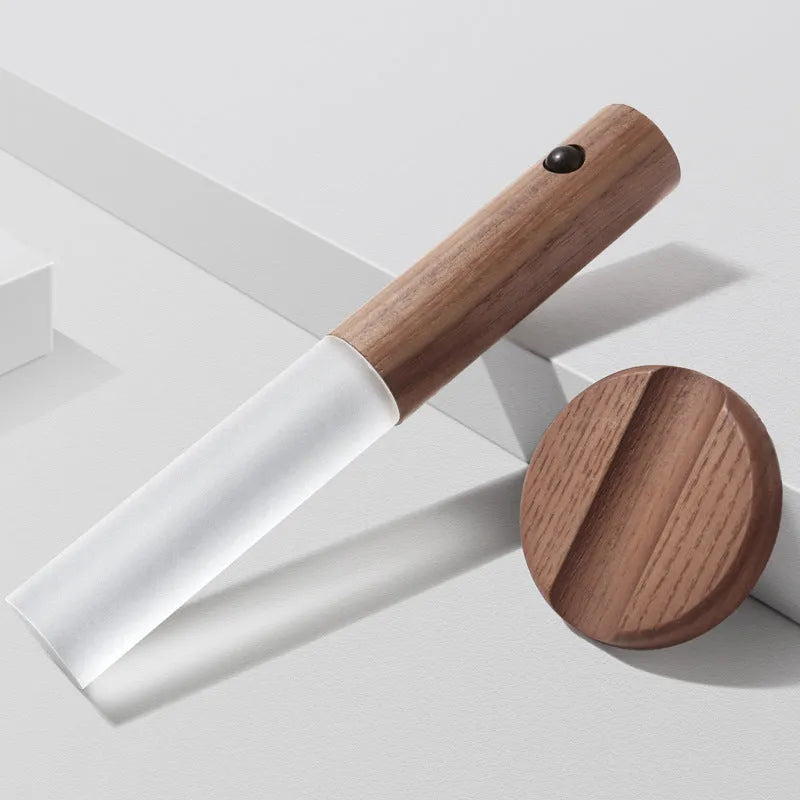 Smart sensor LED desk lamp with solid wood base on a desk