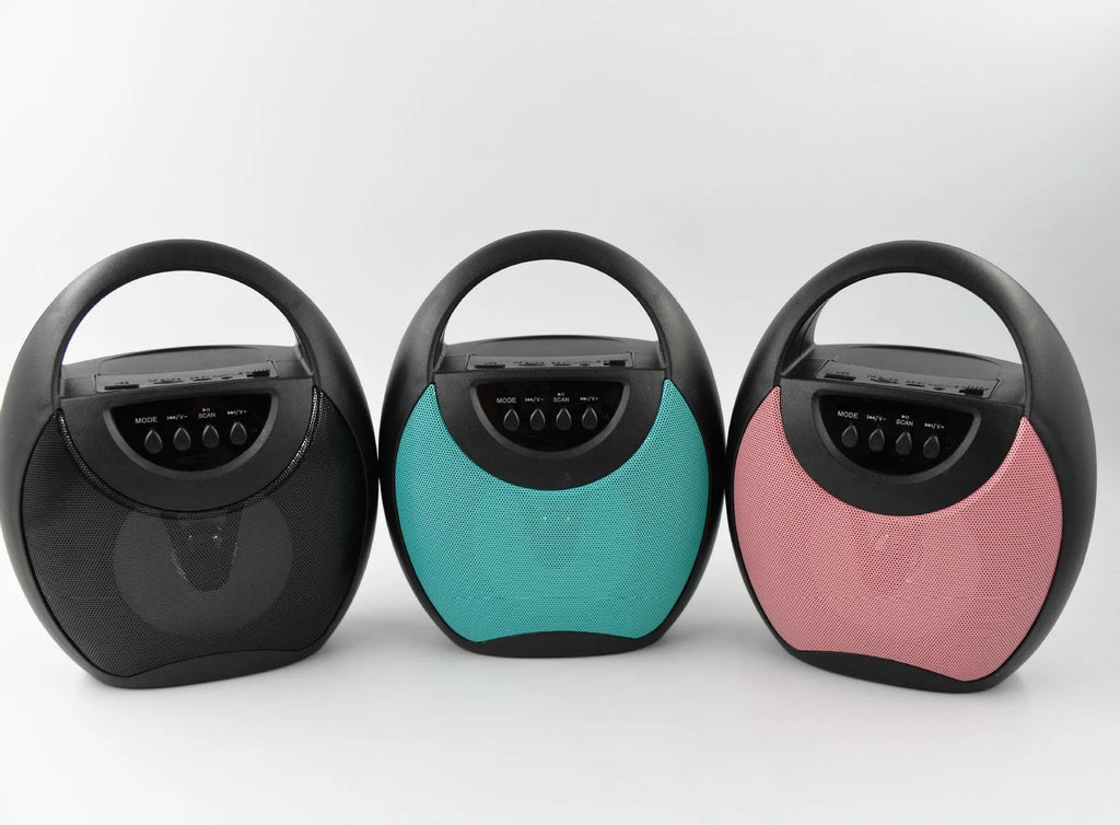Portable Bluetooth speaker in black, blue, or pink colours showing USB port and SD card slot