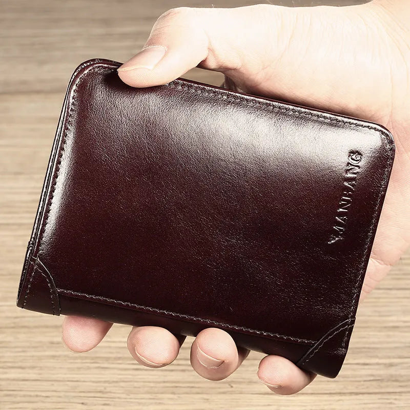 Men's black leather wallet open to show internal card slots, coin pocket, and document sleeve.