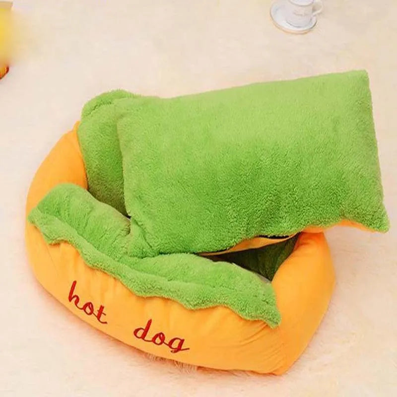 A soft flannelette hot dog bed for pets with a removable mat and anti-slip base, shown in a home setting.