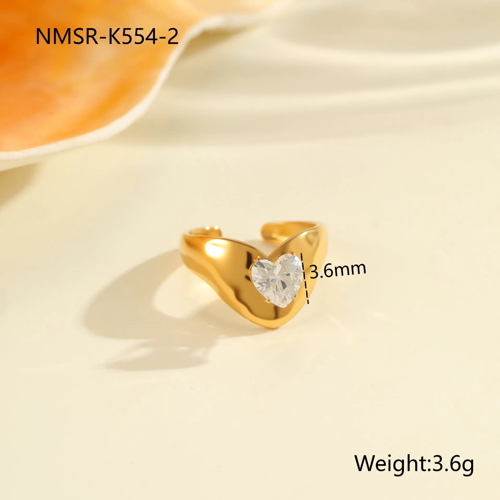 Open mouth geometric zircon ring with round, oval and quadrangle elements on stainless steel band