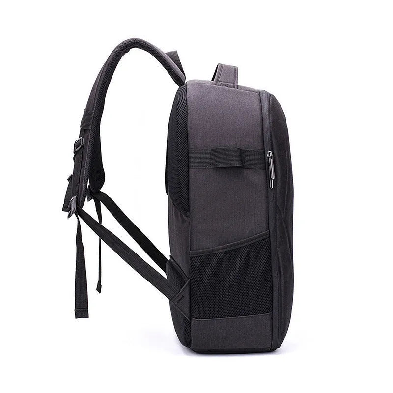 Black Oxford cloth drone backpack with camera and laptop compartments open.