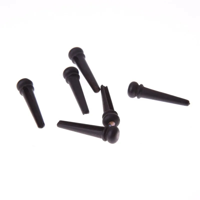 Six ebony guitar string nails with matt black finish for folk acoustic guitars