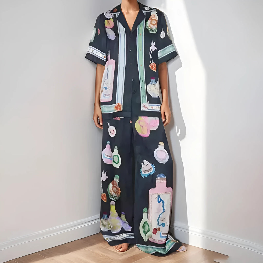 Black women's cardigan set with cartoon pattern, includes top with regular sleeves and matching trousers