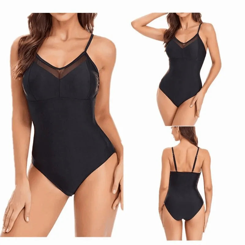 A black one-piece swimsuit with mesh panelling and a backless design on a mannequin.